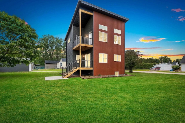 120 Eleonor St, Two Rivers, WI 54241 - back of property featuring a balcony and a lawn