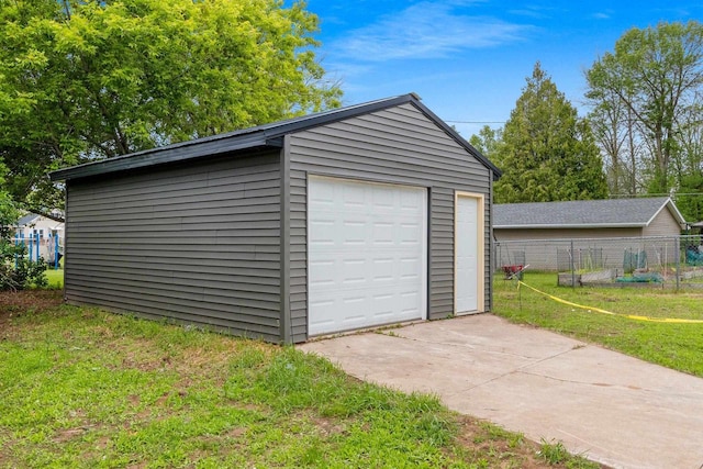 120 Eleonor St, Two Rivers, WI 54241 - detached garage featuring concrete driveway