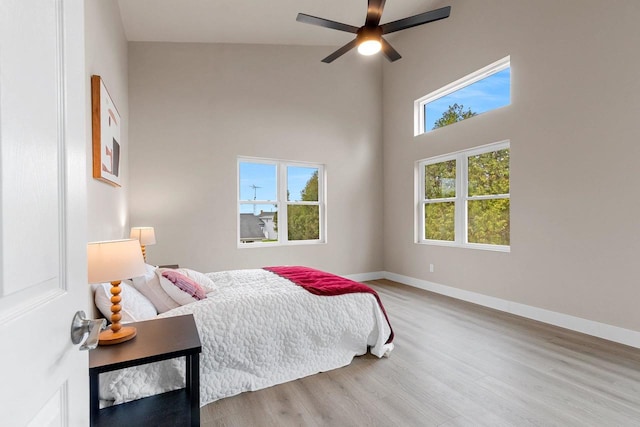 120 Eleonor St, Two Rivers, WI 54241 - bedroom featuring wood finished floors, a high ceiling, and ceiling fan