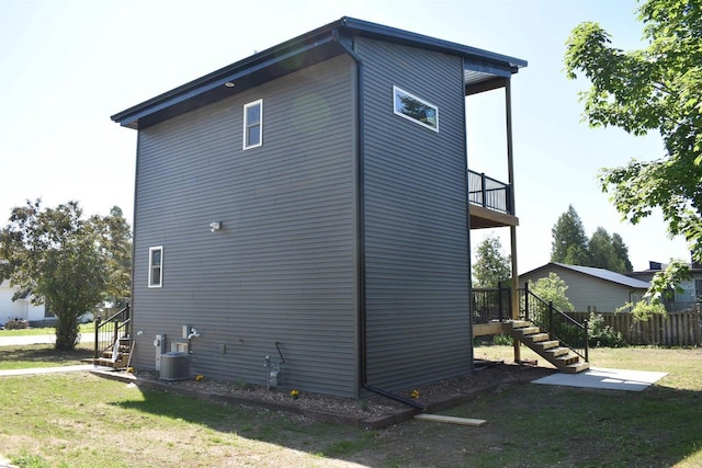 120 Eleonor St, Two Rivers, WI 54241 - view of property exterior featuring stairs and a balcony