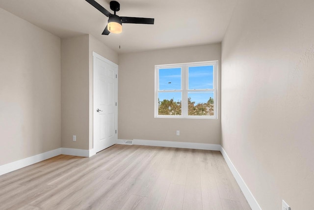 120 Eleonor St, Two Rivers, WI 54241 - unfurnished bedroom with light wood-style floors and ceiling fan