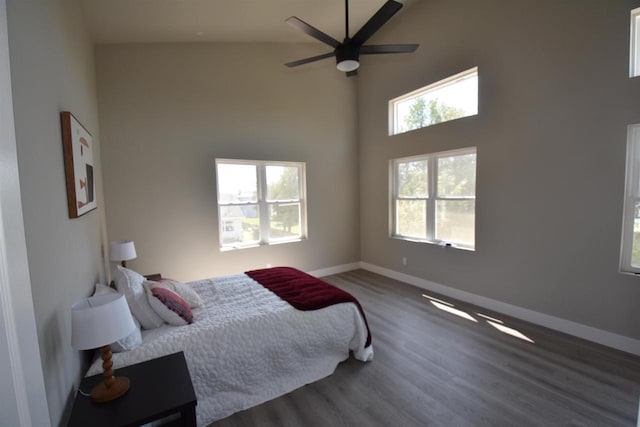 120 Eleonor St, Two Rivers, WI 54241 - bedroom featuring wood finished floors, a towering ceiling, and ceiling fan