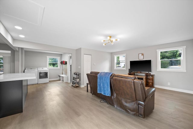 7705 241st Ave, Salem, WI 53168 - living room featuring separate washer and dryer, light wood-style flooring, healthy amount of natural light, and recessed lighting