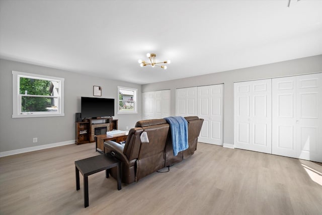 7705 241st Ave, Salem, WI 53168 - living area with light wood-type flooring and a chandelier