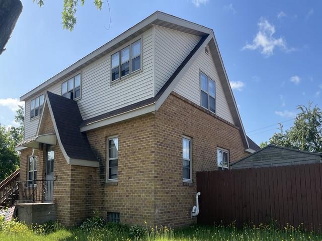 427 N 5th St, Tomahawk, WI 54487 - view of side of home with brick siding