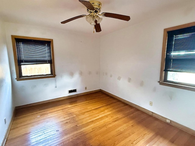 6352 W Medford Ave, Milwaukee, WI 53218 - unfurnished room with light wood finished floors and a ceiling fan