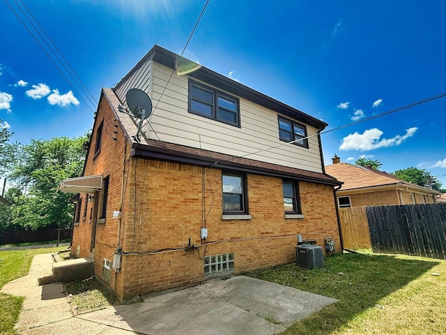 6352 W Medford Ave, Milwaukee, WI 53218 - back of property featuring brick siding and a patio