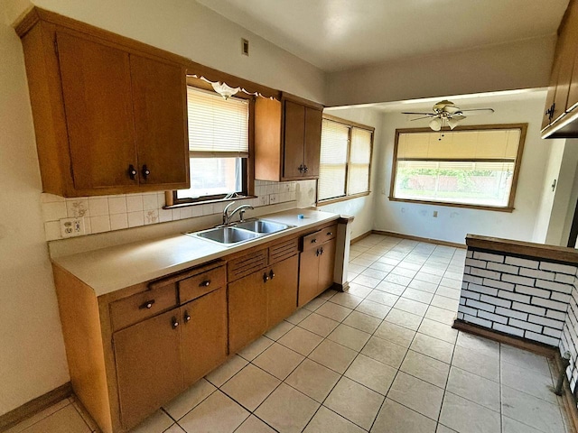 6352 W Medford Ave, Milwaukee, WI 53218 - kitchen featuring light countertops, decorative backsplash, light tile patterned floors, ceiling fan, and brown cabinets