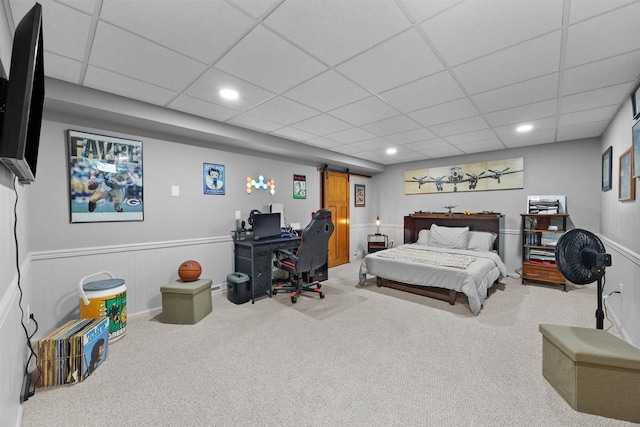 361 Penhurst Way, Nekoosa, WI 54457 - carpeted bedroom with a barn door, a paneled ceiling, recessed lighting, and a wainscoted wall