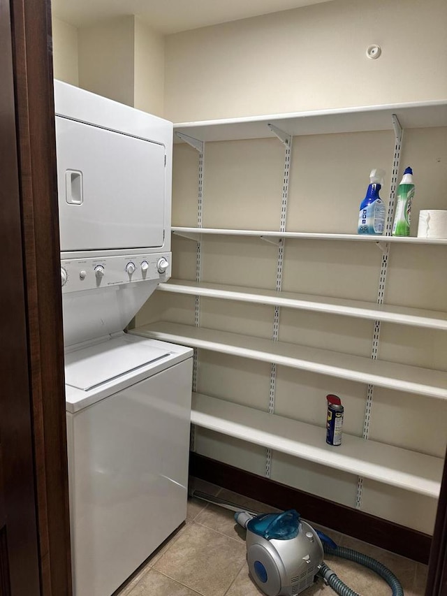 333 W Mifflin St Unit 1156, Madison, WI 53703 - laundry room with stacked washer / dryer and light tile patterned flooring