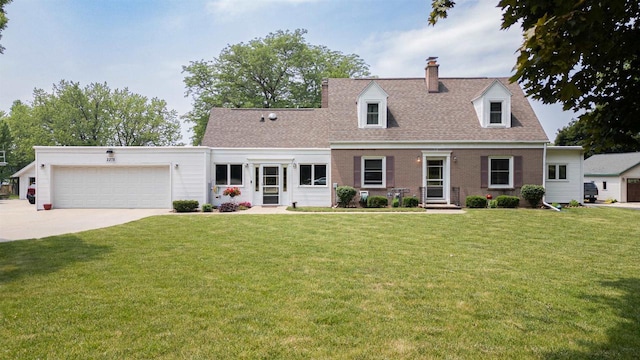 2278 S Riverside Dr, Beloit, WI 53511 - cape cod-style house featuring a chimney, a garage, concrete driveway, a front yard, and roof with shingles