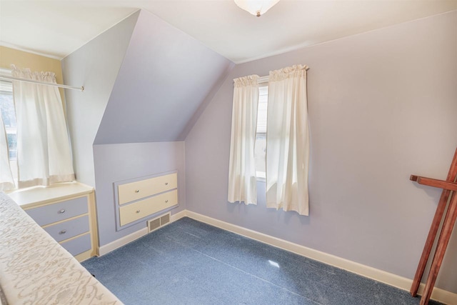2278 S Riverside Dr, Beloit, WI 53511 - unfurnished bedroom featuring lofted ceiling and baseboards