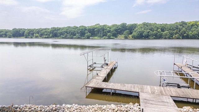 2278 S Riverside Dr, Beloit, WI 53511 - dock area featuring a water view, boat lift, and a wooded view