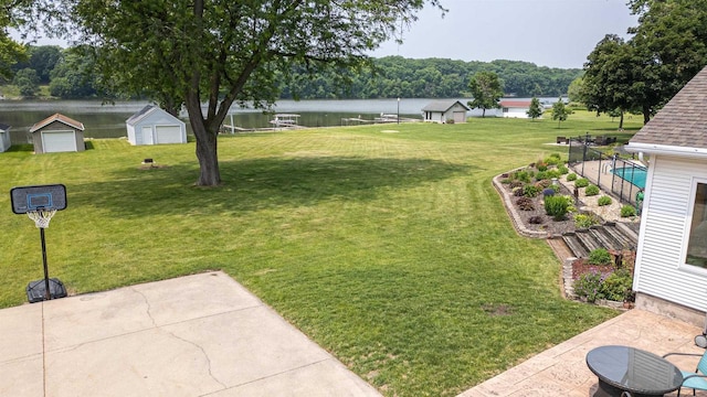 2278 S Riverside Dr, Beloit, WI 53511 - view of grassy yard featuring a water view and a patio
