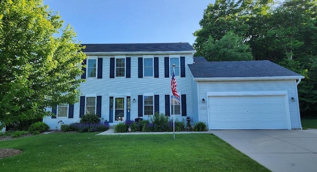 847 Chisholm Ln, Port Washington, WI 53074 - colonial inspired home featuring concrete driveway, an attached garage, and a front yard