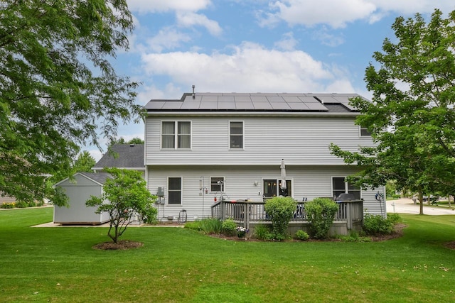 847 Chisholm Ln, Port Washington, WI 53074 - back of house featuring a lawn, roof mounted solar panels, and a deck