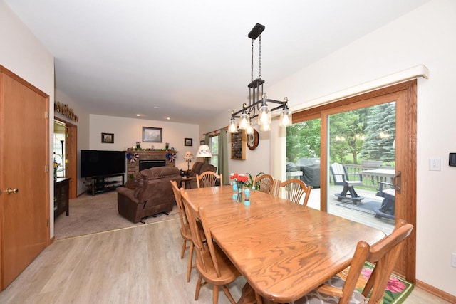 847 Chisholm Ln, Port Washington, WI 53074 - dining room with light wood finished floors and a chandelier