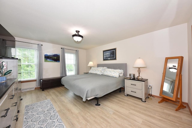 847 Chisholm Ln, Port Washington, WI 53074 - bedroom featuring light wood-type flooring and baseboards