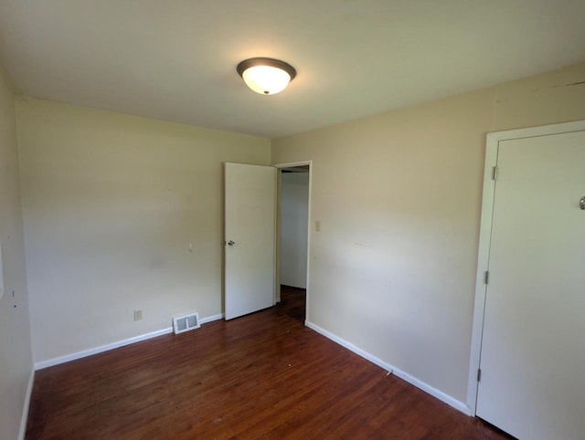 N51W14111 Lancaster Ave, Menomonee Falls, WI 53051 - unfurnished bedroom featuring wood finished floors and baseboards