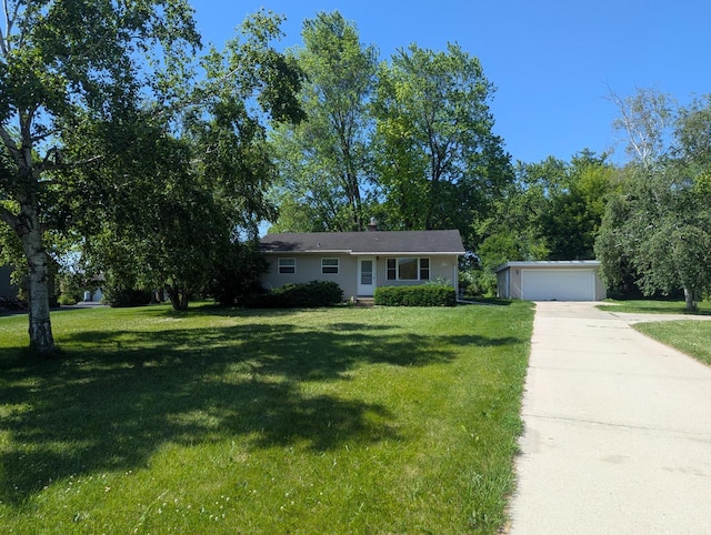 N51W14111 Lancaster Ave, Menomonee Falls, WI 53051 - view of front of house with an outbuilding, a front yard, and a garage