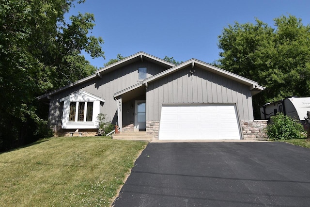6401 237th Ave, Salem, WI 53168 - view of front of house featuring driveway, a garage, a front yard, and stone siding