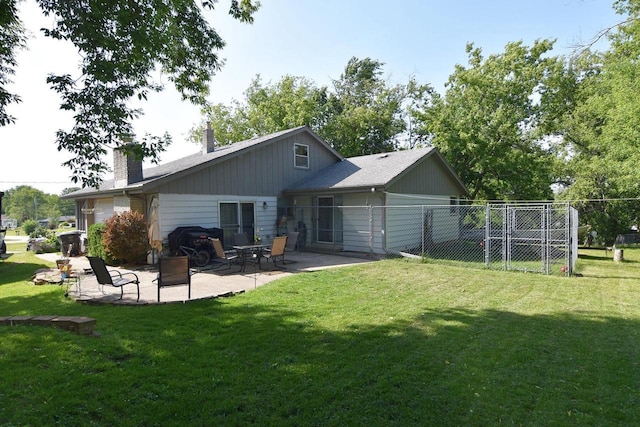 6401 237th Ave, Salem, WI 53168 - back of property with a chimney and a patio area