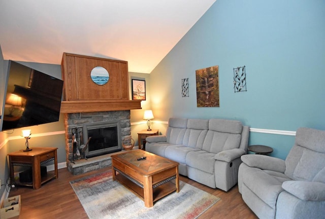 6401 237th Ave, Salem, WI 53168 - living room featuring wood finished floors, vaulted ceiling, and a fireplace
