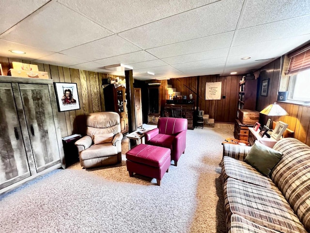 340 Hampton Cir, Nekoosa, WI 54457 - carpeted living room with wood walls and a drop ceiling