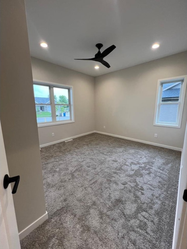 1310 Spahn Dr, Waunakee, WI 53597 - carpeted empty room featuring ceiling fan and recessed lighting
