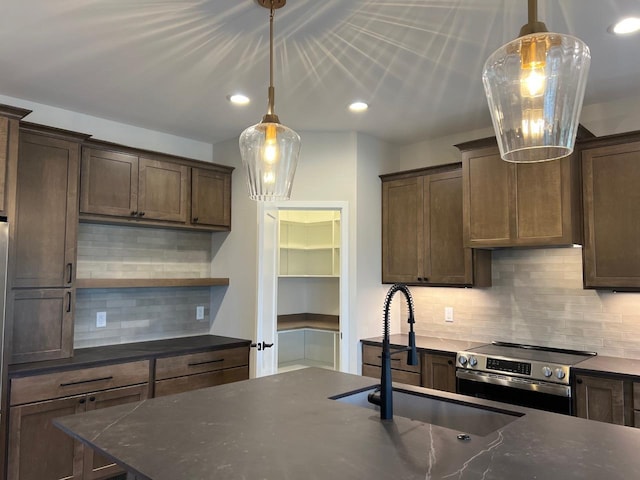 1310 Spahn Dr, Waunakee, WI 53597 - kitchen with stainless steel range with electric stovetop, tasteful backsplash, dark brown cabinets, open shelves, and pendant lighting