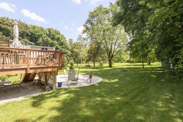 2335 Macarthur Rd, Waukesha, WI 53188 - view of grassy yard with a patio area, a deck, and view of scattered trees