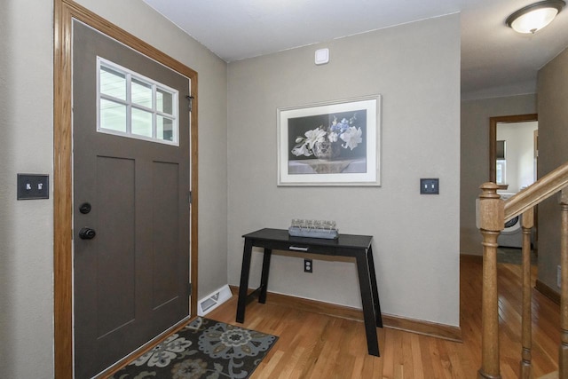 2335 Macarthur Rd, Waukesha, WI 53188 - foyer entrance with light wood finished floors and stairs