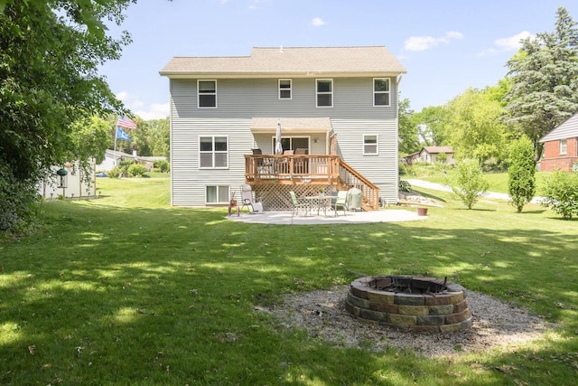 2335 Macarthur Rd, Waukesha, WI 53188 - rear view of property with an outdoor fire pit, a patio, a lawn, and a wooden deck