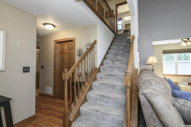 2335 Macarthur Rd, Waukesha, WI 53188 - stairway featuring wood finished floors and a ceiling fan