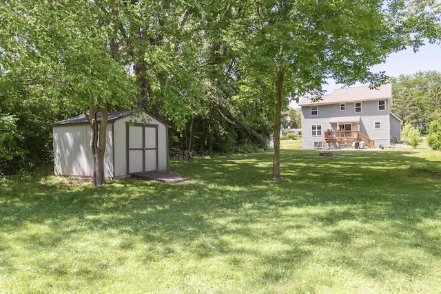 2335 Macarthur Rd, Waukesha, WI 53188 - view of grassy yard featuring a storage shed and a wooden deck