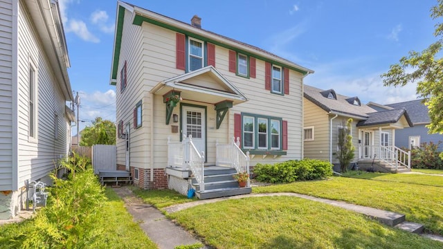1345 Annie Ct, Sheboygan, WI 53083 - view of front of home with a front lawn and a chimney