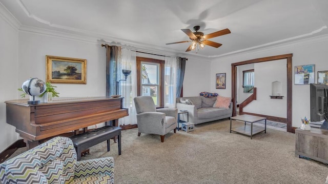 1345 Annie Ct, Sheboygan, WI 53083 - living room with plenty of natural light, ornamental molding, a ceiling fan, and light colored carpet