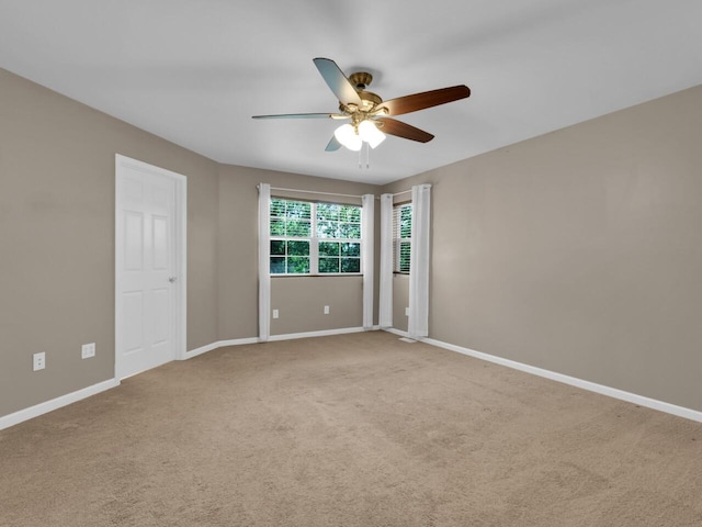 N8986 Swift Lake Dr, East Troy, WI 53120 - carpeted empty room featuring a ceiling fan and baseboards