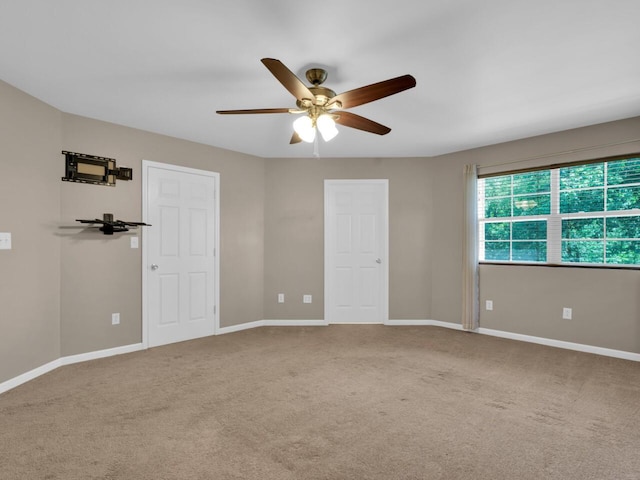 N8986 Swift Lake Dr, East Troy, WI 53120 - unfurnished bedroom featuring carpet flooring and ceiling fan