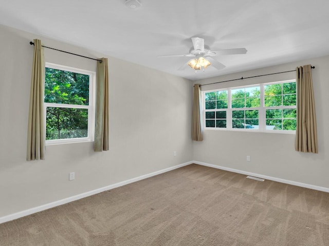 N8986 Swift Lake Dr, East Troy, WI 53120 - spare room with carpet and a ceiling fan