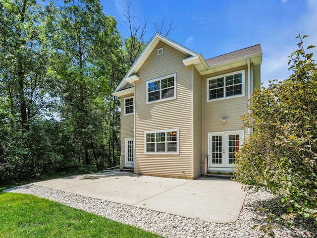 N8986 Swift Lake Dr, East Troy, WI 53120 - back of property featuring french doors, a patio, and entry steps