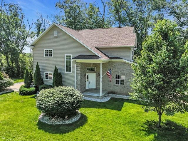 N8986 Swift Lake Dr, East Troy, WI 53120 - view of front of property featuring a front lawn and a shingled roof