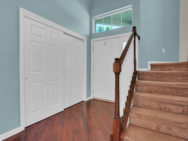 N8986 Swift Lake Dr, East Troy, WI 53120 - entryway with dark wood finished floors and stairway