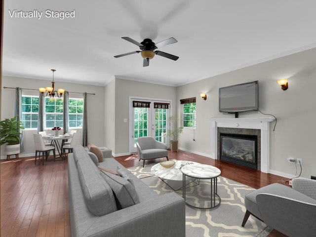 N8986 Swift Lake Dr, East Troy, WI 53120 - living area with a chandelier, dark wood-type flooring, ceiling fan, ornamental molding, and a fireplace