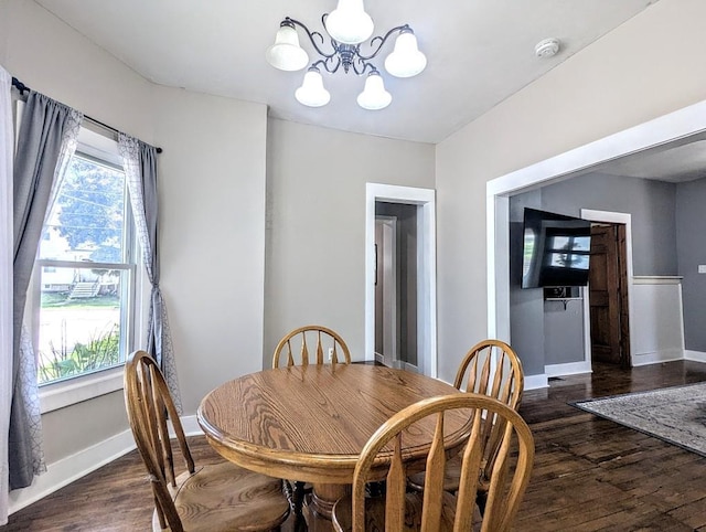 232 4th St, Neenah, WI 54956 - dining space featuring a chandelier and dark wood-type flooring