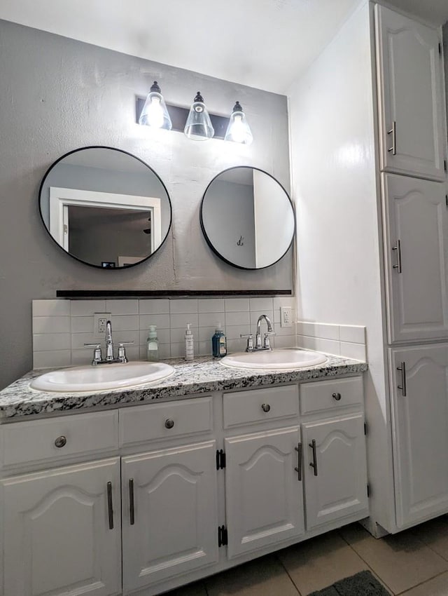 232 4th St, Neenah, WI 54956 - full bathroom featuring double vanity, tile patterned floors, and tasteful backsplash
