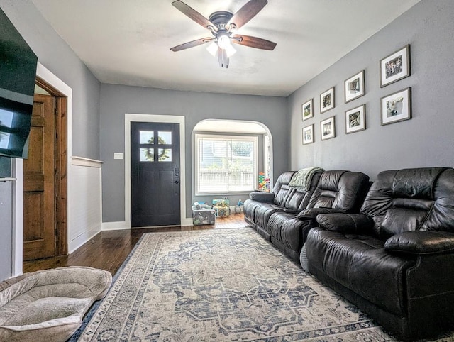 232 4th St, Neenah, WI 54956 - living area with wood finished floors, a ceiling fan, and arched walkways