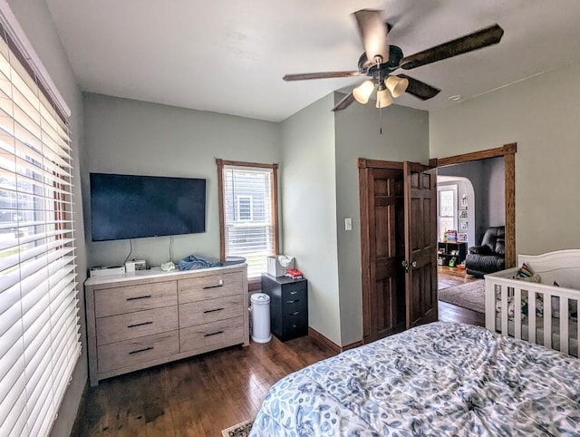 232 4th St, Neenah, WI 54956 - bedroom with dark wood-style floors and a ceiling fan