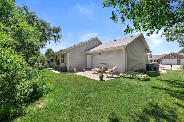 10724 S Christina Ct, Oak Creek, WI 53154 - rear view of house featuring a patio area and a lawn