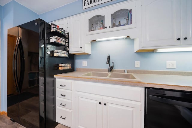 531 E Taft Ave, Appleton, WI 54915 - kitchen featuring black appliances, light countertops, white cabinets, and glass insert cabinets